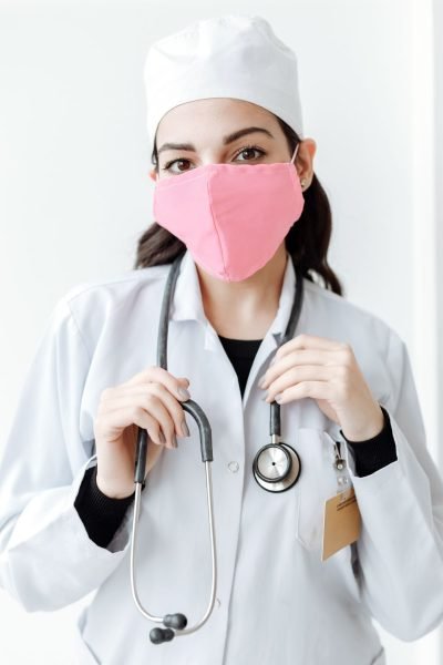 A doctor wearing a face mask and stethoscope